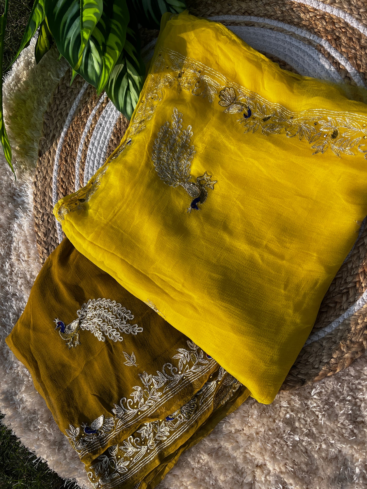 Lightweight Olive Green and Yellow Pure Chiffon Saree hand-embroidered with traditional Aari Tari and sparkling Peacock Aari Butta motifs, perfect for wedding wear. A perfect Color Combination.