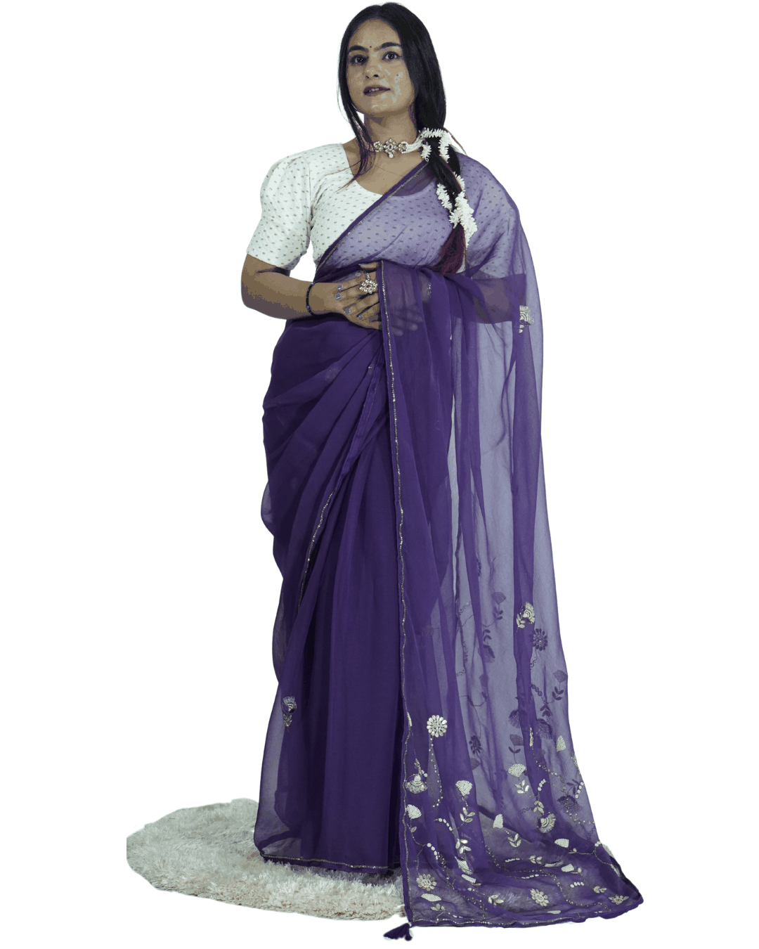 Model wearing a deep purple handcrafted saree with delicate floral embroidery, styled with traditional jewelry, showcasing Amai Jaipur’s sustainable luxury ethnic wear inspired by Jaipur craftsmanship.