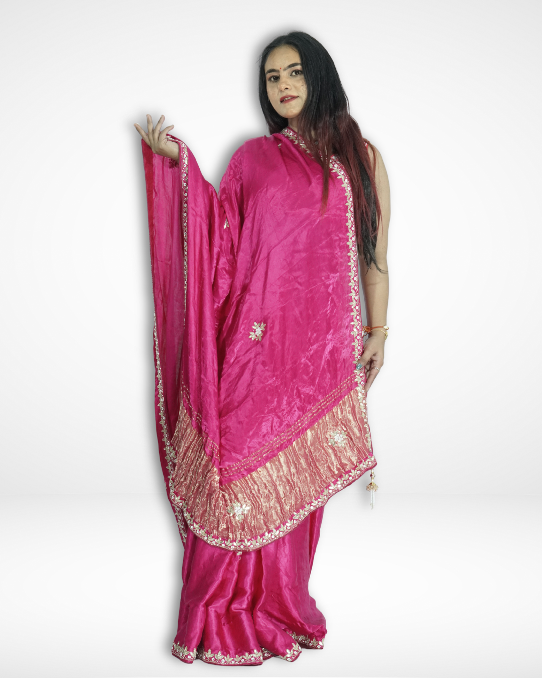 Model posing in a vibrant pink handcrafted silk saree with delicate floral embroidery and elegant gold zari border, showcasing Amai Jaipur’s sustainable luxury ethnic wear inspired by traditional Jaipur craftsmanship.