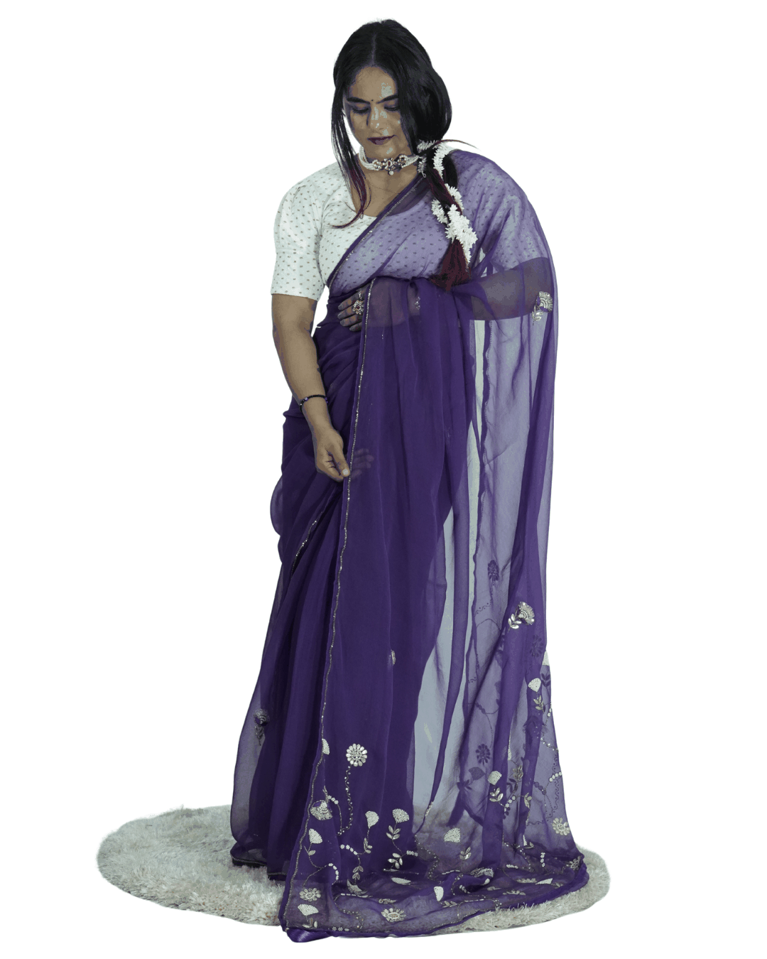Woman styling a deep purple handcrafted saree with fine floral embroidery and sheer drape, reflecting Amai Jaipur’s sustainable luxury ethnic wear and timeless Jaipur craftsmanship.