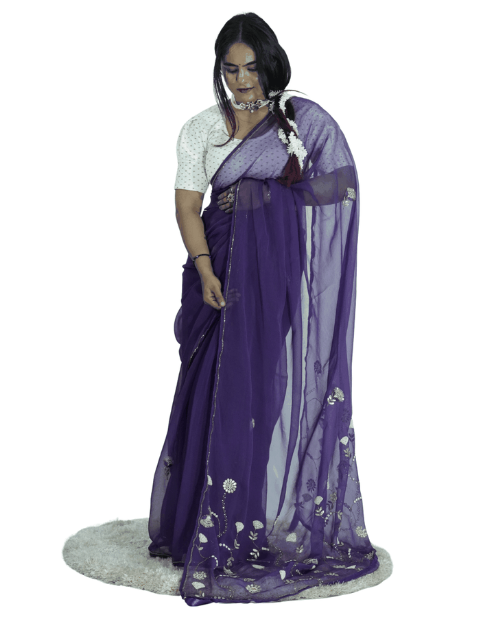 Woman styling a deep purple handcrafted saree with fine floral embroidery and sheer drape, reflecting Amai Jaipur’s sustainable luxury ethnic wear and timeless Jaipur craftsmanship.