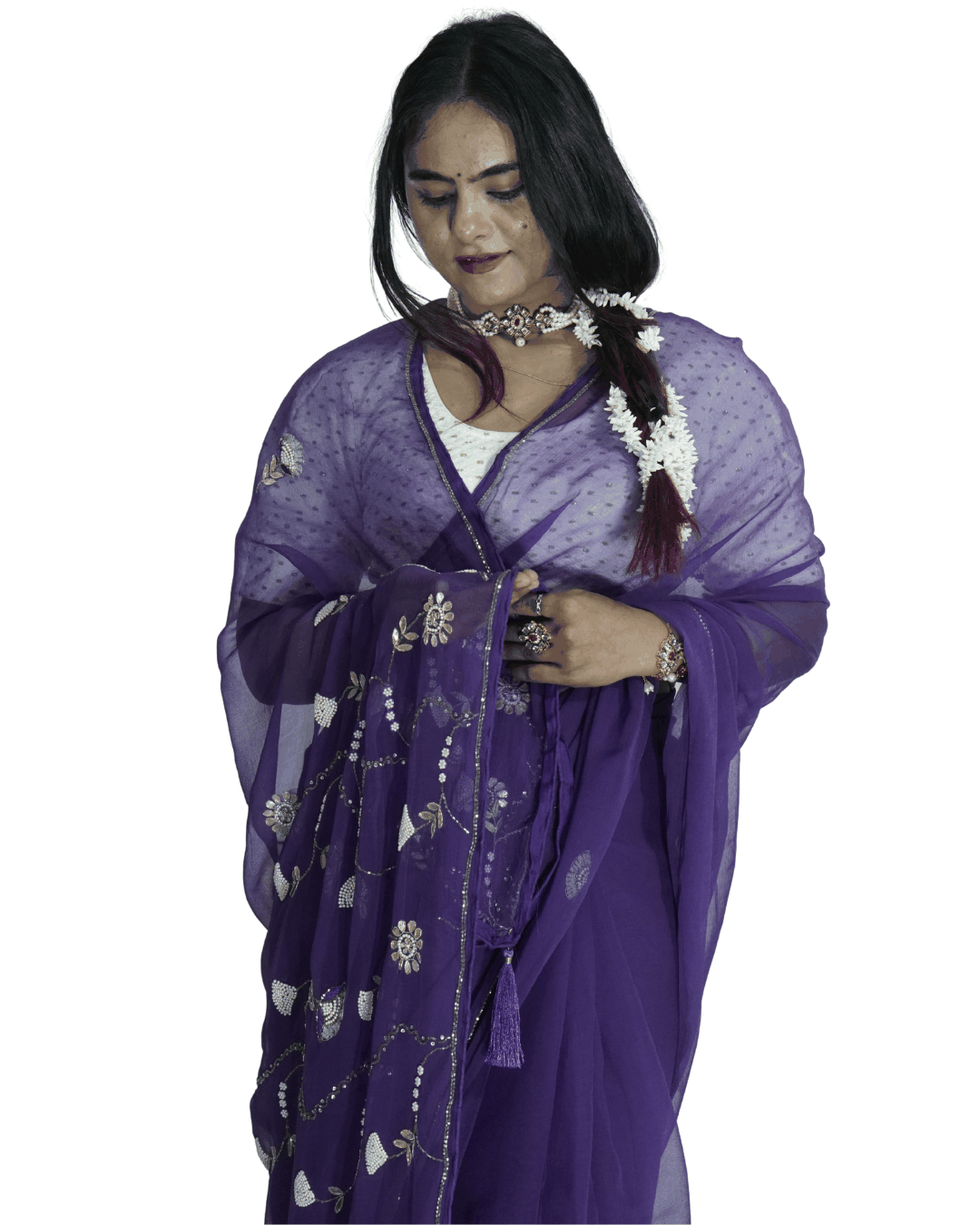 Woman draped in a deep purple handcrafted saree with sheer fabric and intricate floral embroidery, styled with traditional jewelry, showcasing Amai Jaipur’s sustainable luxury ethnic wear and Jaipur craftsmanship.