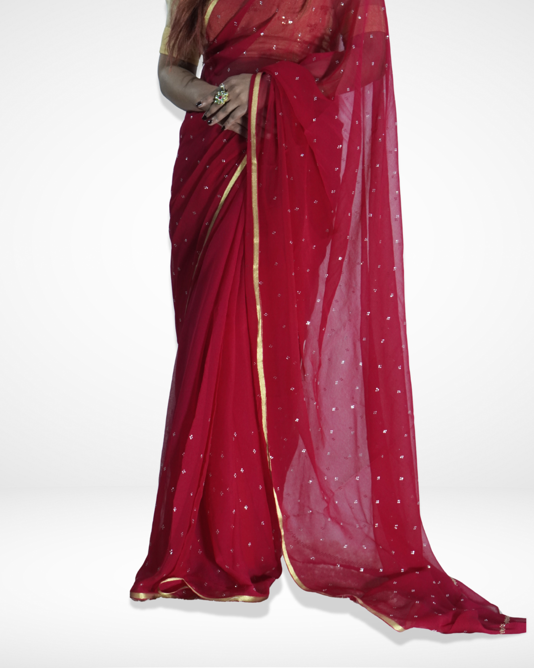 Detailed view of a red georgette saree with delicate silver sequin embellishments and a minimal gold border, highlighting Amai Jaipur’s elegant handcrafted designer saree perfect for festive occasions, party wear, and modern ethnic fashion.