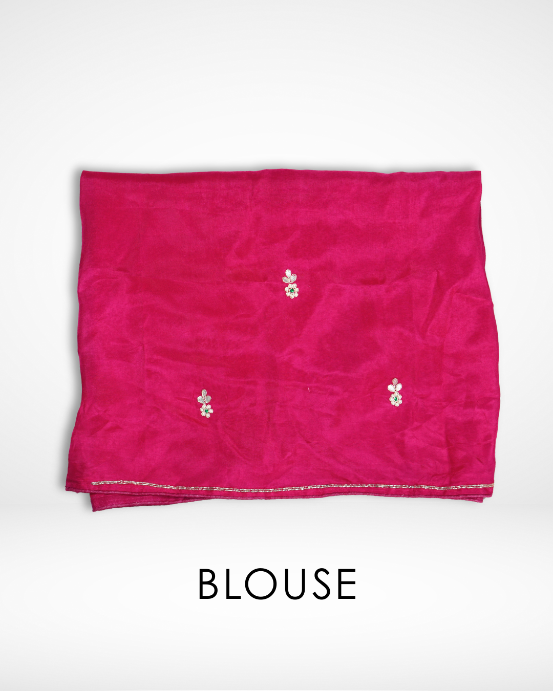 Pink blouse fabric with small delicate floral embroidery motifs and a subtle gold border, designed to complement a traditional pink saree. ✨