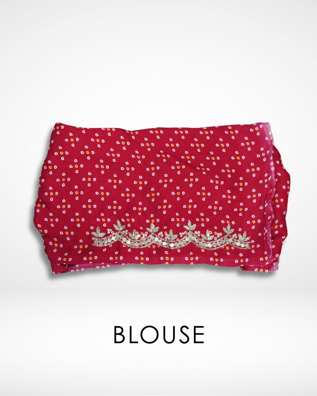 Red bandhani-style blouse fabric with delicate gold embroidered border, designed to complement Amai Jaipur’s handcrafted saree collection inspired by traditional Jaipur craftsmanship and sustainable luxury fashion.