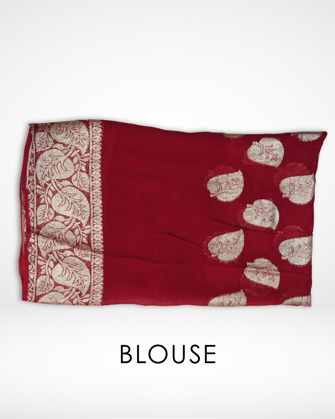 Red Banarasi chiffon blouse fabric with gold zari leaf motifs and intricate woven border, designed to complement Amai Jaipur’s handcrafted luxury saree collection for weddings, bridal wear, and festive ethnic fashion.