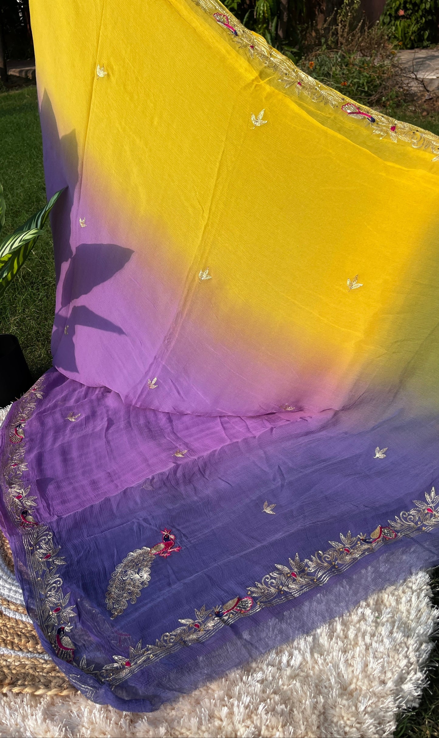 Lightweight Pastel Lavender, Saucy Yellow, and Olive Green Pure Chiffon Saree, hand-embroidered with traditional Aari Tari and sparkling Peacock Aari Butta motifs. This Picture Showcases Pallu from a different Angle.
