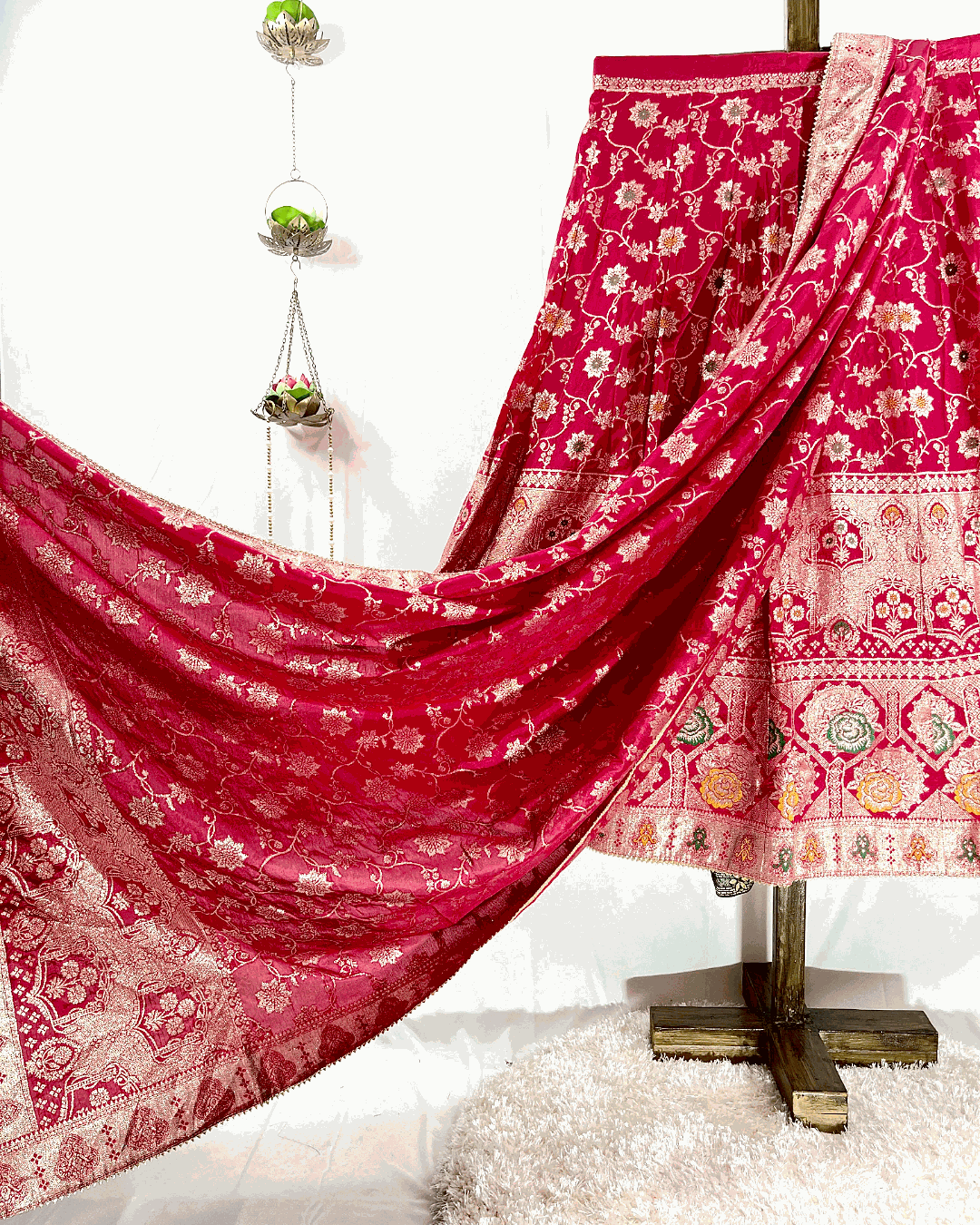 Close-up view of the Red Dola Silk Lehenga skirt, showcasing the intricate gold Meenakari Zari Weaving and rich bridal detail, perfect for traditional Rajasthani weddings.