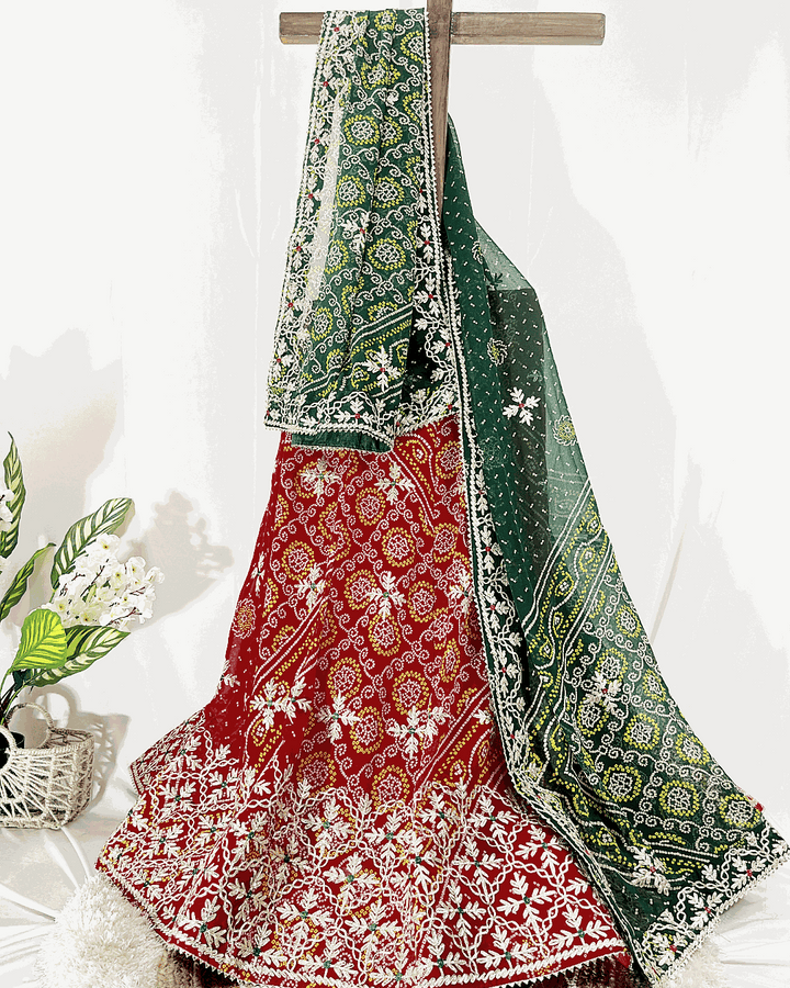 Detailed view of the light pink floral print lehenga ghagra and dupatta, showcasing the gold crisscross Gota Patti border and lightweight fabric texture.