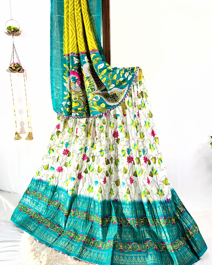 Close-up view of the light pink floral digitally printed cotton lehenga skirt, showcasing the detailed gold crisscross Gota Patti border and lightweight texture, suitable for summer festive occasions.