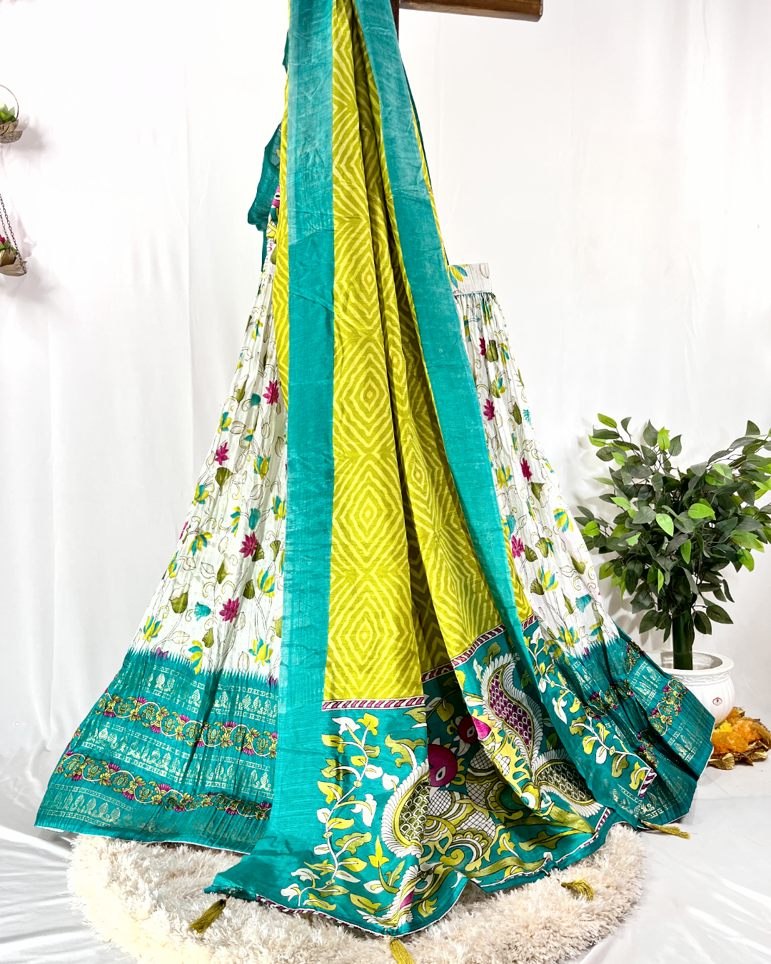 White and Green Floral Digitally Printed Cotton Lehenga Choli featuring vibrant vine motifs and a peacock design dupatta with gold border details, perfect for summer festive wear.