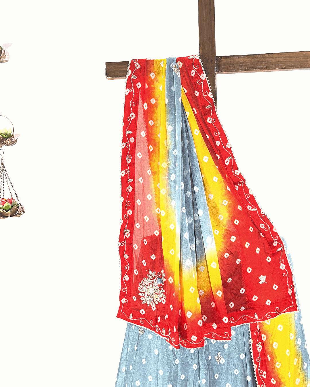 Light pink floral printed lehenga skirt and dupatta set featuring a gold crisscross Gota Patti border, ideal for summer festive wear.